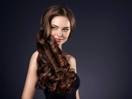 Beauty hair woman curly hairstyle natural makeup. Studio shot.の写真素材