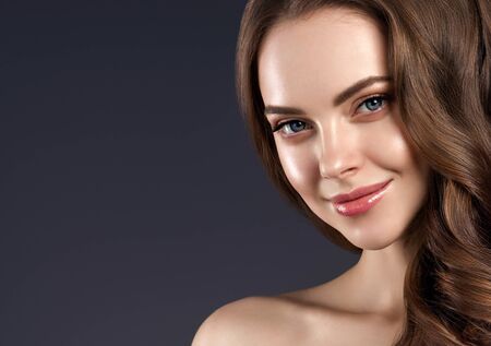 Beauty hair woman curly hairstyle natural makeup. Studio shot.の写真素材