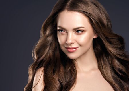 Beauty hair woman curly hairstyle natural makeup. Studio shot.の写真素材