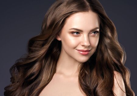 Beauty hair woman curly hairstyle natural makeup. Studio shot.の写真素材
