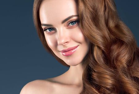 Beauty hair woman curly hairstyle natural makeup. Studio shot.の写真素材