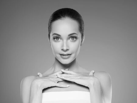 Skin care woman beauty face healthy face skin cosmetic model emotional andhappy. Studio shot.  Monochrome. Gray. Black and white.の写真素材