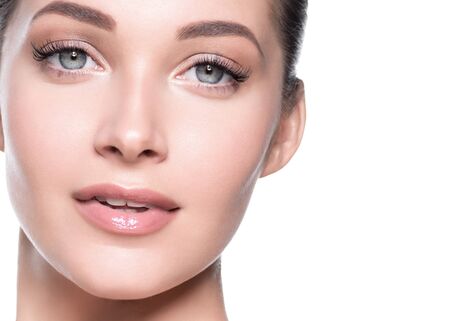 Woman beauty face healthy skin natural makeup beautiful young model. Studio shot.の写真素材