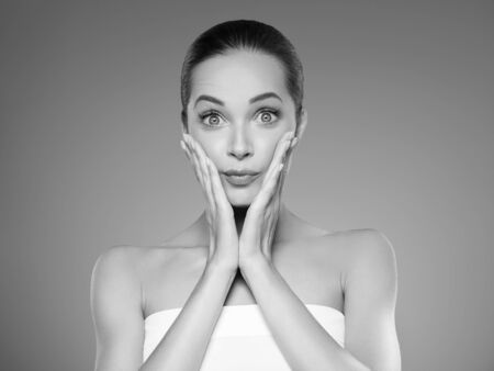 Skin care woman beauty face healthy face skin cosmetic model emotional andhappy. Studio shot.  Monochrome. Gray. Black and white.の写真素材