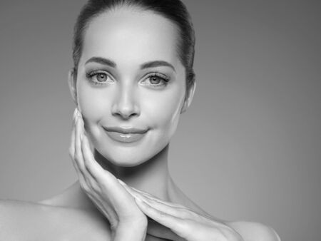 Skin care woman beauty face healthy face skin cosmetic model emotional andhappy. Studio shot.  Monochrome. Gray. Black and white.の写真素材