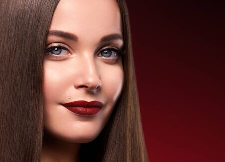 Beautiful hair woman long smooth brunette hairstyle beauty healthy hair female model portrait.  Studio shot.の写真素材
