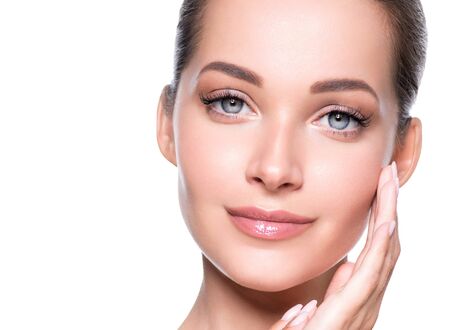 Woman beauty face healthy skin natural makeup beautiful young model. Studio shot.の写真素材