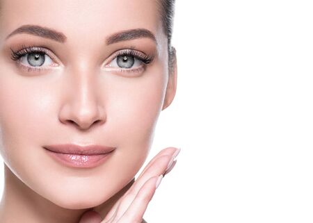Woman beauty face healthy skin natural makeup beautiful young model. Studio shot.の写真素材