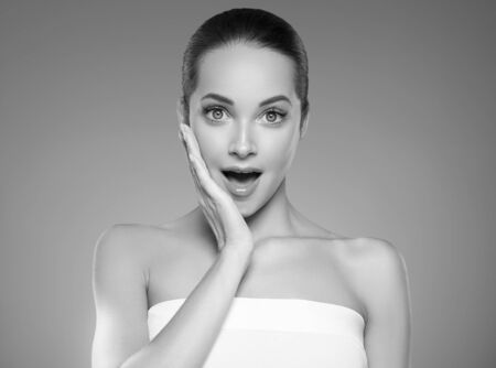 Skin care woman beauty face healthy face skin cosmetic model emotional andhappy. Studio shot.  Monochrome. Gray. Black and white.の写真素材