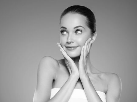 Skin care woman beauty face healthy face skin cosmetic model emotional andhappy. Studio shot.  Monochrome. Gray. Black and white.の写真素材