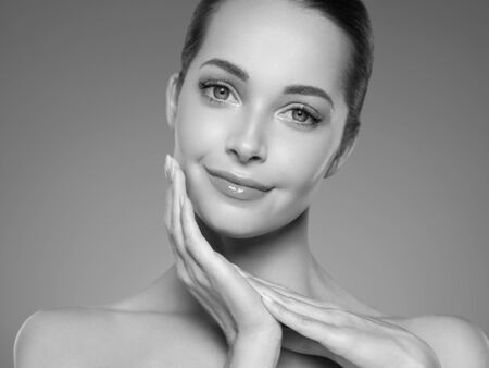 Skin care woman beauty face healthy face skin cosmetic model emotional andhappy. Studio shot.  Monochrome. Gray. Black and white.の写真素材