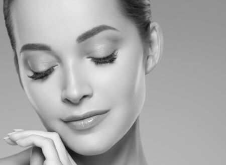 Skin care woman beauty face healthy face skin cosmetic model emotional andhappy. Studio shot.  Monochrome. Gray. Black and white.の写真素材