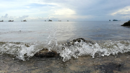 Foam in the sea on the beach in Rayong, Thailand