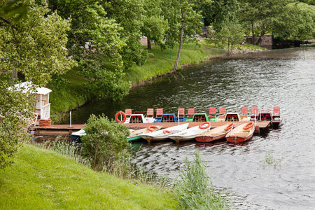 Parking of walking boats on a pond in parkの写真素材
