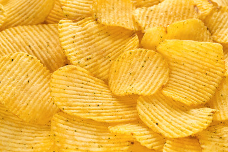 Golden subfried potato slices with onions pieces.の写真素材