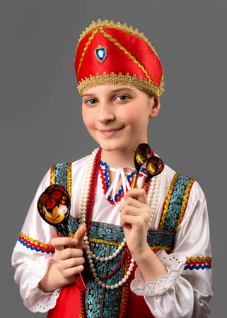 girl is in the Russian national suit on a gray backgroundの写真素材