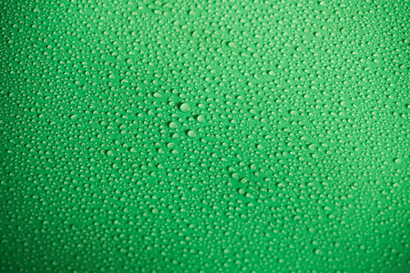 Water drops on green backgroundの写真素材