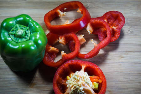 Colorful capsicum on wooden table background.Image with selective focus.