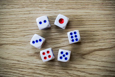 Dices on wooden tableの写真素材