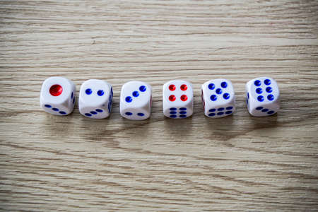 Dices on wooden table backgroundの写真素材
