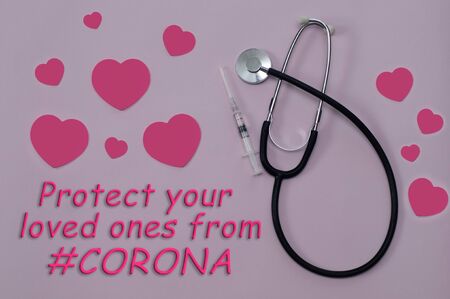 Vaccine syringe, stethoscope and hearts on pink background. Text saying Protect your loved ones from corona. Concept of flu outbreak and outbreak prevention.の写真素材