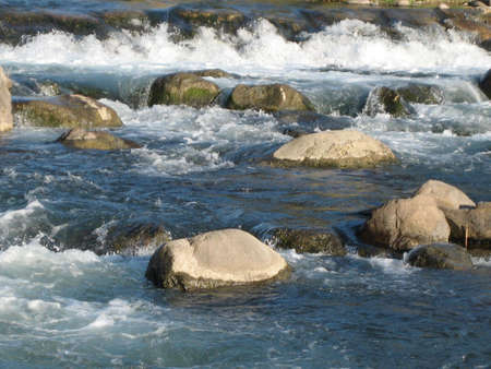 Water with reflection and stones