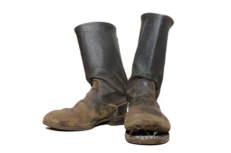 The old soldiers boots on white background 