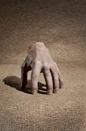 Horrible, dirty hand ghost which walks by itself.の写真素材