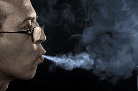 The man smoker jetting of tobacco smoke