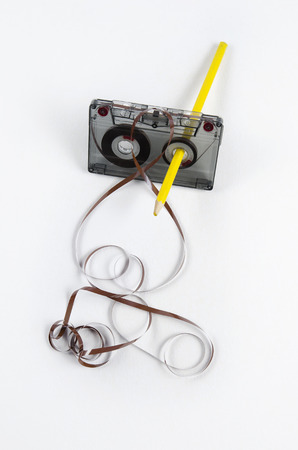 Tape and a pencil - a simple device to rewind tapes.の写真素材