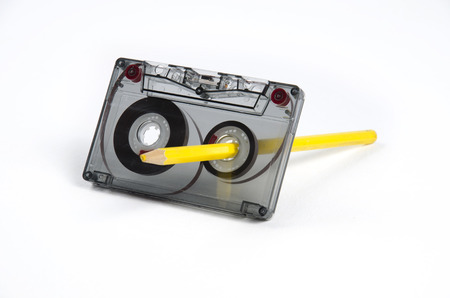 Tape and a pencil - a simple device to rewind tapes.の写真素材