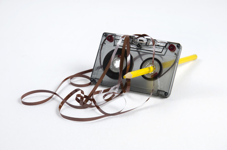 Tape and a pencil - a simple device to rewind tapes.の写真素材