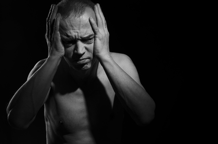 A person experiencing a severe headache.の写真素材