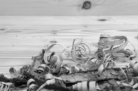Wooden shavings on a wooden table in black and white.の写真素材