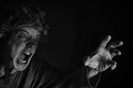 Portrait of a fiercely screaming soldier in black and white. "When they killed your brother in arms ..."の写真素材