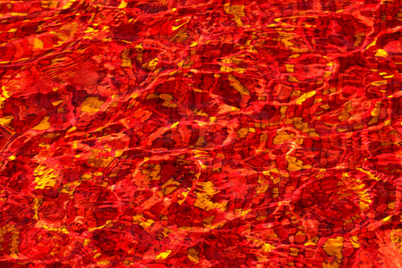 red mosaic rippled water in swimming poolの写真素材