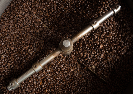 Roasting process of coffee. The freshly roasted coffee beans in the cooling cylinder from top viewの写真素材