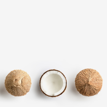Tropical fruit whole and half abstract background .Coconut on white background. from top viewの写真素材
