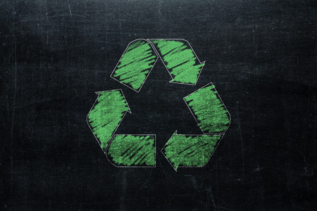 Recycle sign on chalkboard isolated on blackboard texture with chalk rubbed