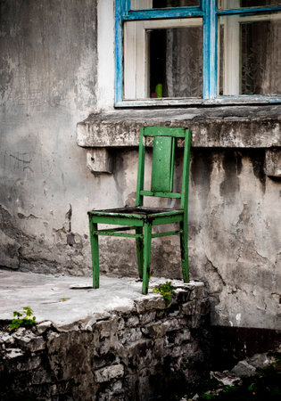 old chair near the windowsの写真素材