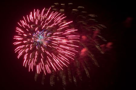 Colorful fireworks over night sky background
