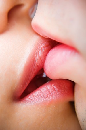 Close-up of kissing lips, selective focus の写真素材