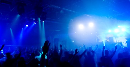 Panoramic photo of people hanging out at the concert, blurred motion 