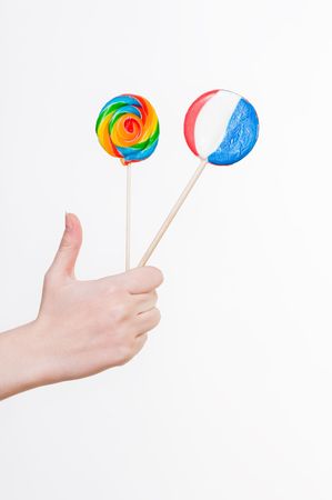 Female hand with lollipops, studio shot の写真素材