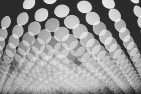 Abstract bokeh white lights patern background black and whiteの写真素材
