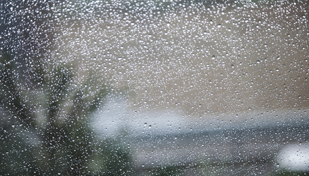Detail · Close up photo of street through window full of rain
