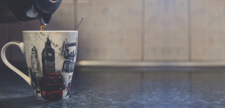 Pouring coffee in kitchen copyspaceの写真素材