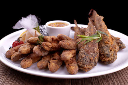 Fried fish on a white plate, on a board. Bulls, Barabolaの写真素材