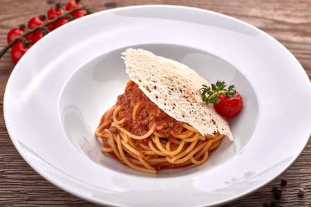 Spaghetti Bolognese on a white plateの写真素材
