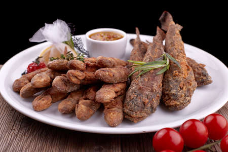 Fried fish on a white plate, on a board. Bulls, Barabolaの写真素材